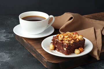 Brownie cake with chocolate and hazelnuts on plate