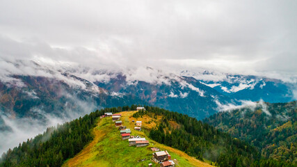 Aerial view of Pokut Plateau. Photo of plateau houses with foggy mountain view. Rize, Turkey.
