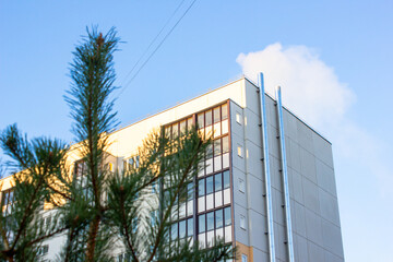 Residential apartment building near a forest and park. High-rise building with apartments with an ecological park, in an ecologically clean area.