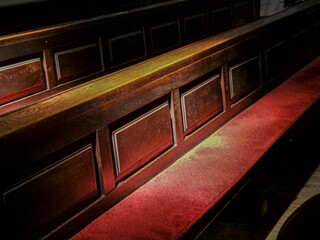 Parts of pews with red seat cashion