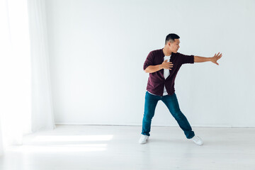 Enjoy The Rhytm. Cheerful American Guy In Wireless Headphones Listening Music And Dancing,