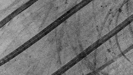 Aerial view tire track mark on asphalt tarmac road race track texture and background, Abstract...
