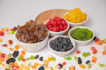 Mixed nuts on white bowl with white background, mixed dry fruits and nuts on white bowl with white background