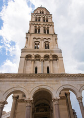 Fototapeta na wymiar The Romanesque bell tower of the Cathedral of Saint Domnius - Katedrala Svetog Duje - in Split, Croatia. Located within the Diocletian Palace. Seen from Peristil 