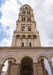 Obraz premium The Romanesque bell tower of the Cathedral of Saint Domnius - Katedrala Svetog Duje - in Split, Croatia. Located within the Diocletian Palace. Seen from Peristil 