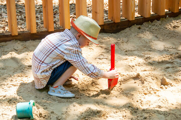 Child on playground in summer park