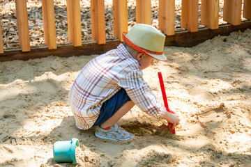 Child on playground in summer park