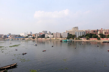 People on both sides of the Buriganga river in Dhaka cross the river by traditional boat in this country because of the mother river.