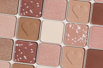 Trend pattern with refill eye shadow swatches, beige brown natural colors on light background. Eyeshadows powder for make up, shiny and matte, minimal aesthetic photo, pastel color, view, flat lay