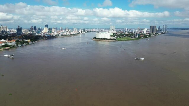 Aerial drone footage above the Mekong and Tonle Sap in Phnom Penh, Cambodia. Camera is moving foward to Chroy Changvar peninsula