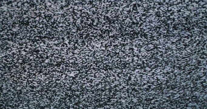 Video error. Abstract noise of analog television. Digital glitch. Damage to the video signal with pixel noise and noise. Black and white grey background. Retro tv.