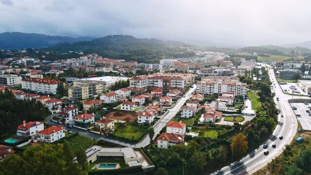 Stunning aerial 4K drone footage of a village - Ponte de Lima, Portugal. Filmed in autumn during partly cloudy weather.