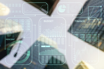 Double exposure of abstract virtual statistics data hologram on modern skyscrapers background, statistics and analytics concept