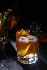 Orange rosemary bourbon cocktail in low key