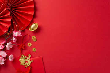 Celebrate Chinese New Year in style: Top view composition flaunting fans, Feng Shui lucky coins,...
