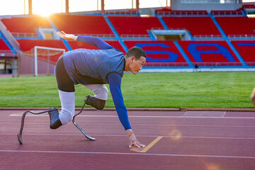Asian para-athlete with prosthetic blades leg in stadium practicing workout for Paralympic running competition. Amputee sportsman runner practicing running workout. Disabled athlete man sport concept.