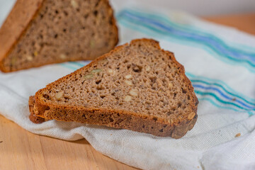 sliced whole grain bread lies on a towel