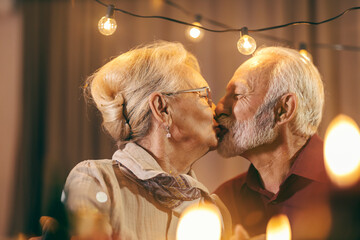 Portrait of a loving senior couple kissing.