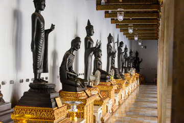 Lots of different statues of the Buddha at Wat Benchamabophit (The Marble Temple), Bangkok, Thailand