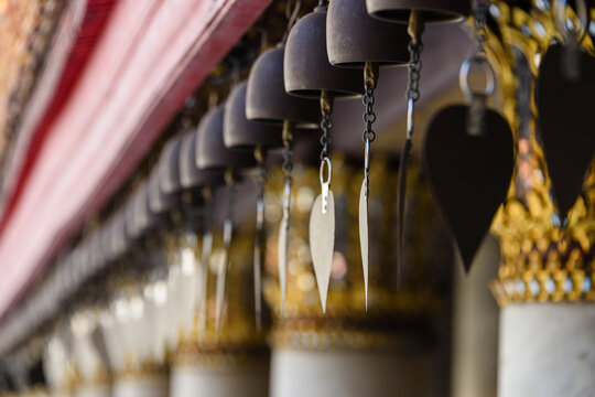 Cast iron bells wind chimes outside Wat Benchamabophit (The Marble Temple), Bangkok, Thailand