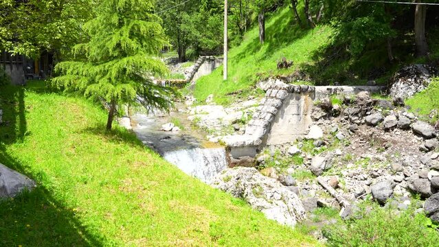 Little cascade created by overflow of dam in Sottoguda, Italy. Static