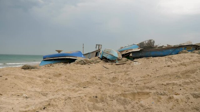Gaza sea beach and destroyed boats after the attack, Israel Hamas War 2023