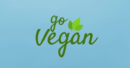 Composite of go vegan text over blue background with copy space