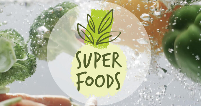 Composite of superfoods text over fresh vegetables in water with copy space