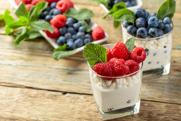 Curd dessert with berries and mint.