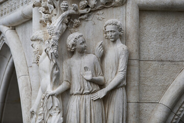 Fototapeta na wymiar Sculpture Drunkenness of Noah on the exterior of the Doge's Palace (Italian: Palazzo Ducale), one of the main Venetian landmarks. Venice - 5 May, 2019