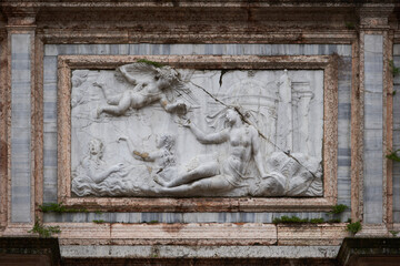 Bas relief of Venus as an allegory of Cyprus on Loggetta del Sansovino building. Venice - 5 May, 2019