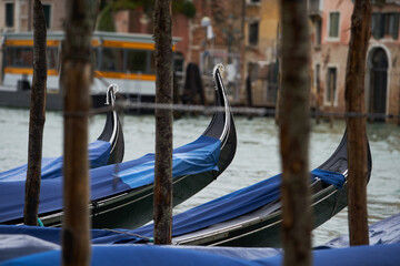 Traditional gondolas in Venetian canal. Gondola boats in Grand Canal. Venice - 5 May, 2019
