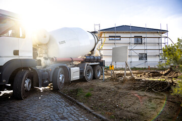 Concrete Mixer Truck on a Residential Construction Site in Germany - obrazy, fototapety, plakaty