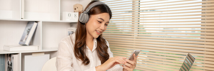 Woman working at home, Attractive woman chatting or talking with colleague on mobile phone at her home, Work for home, Remote conversation or meeting , Stay home, Use a cell phone or smartphone.