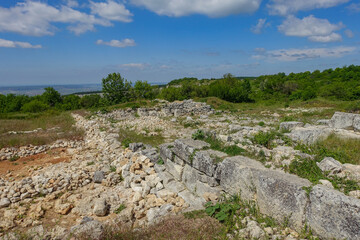Fototapeta na wymiar Ancient buildings cave fortress city Mangup-Kale, sunny day. Mountain view from the ancient cave town of Mangup-Kale in the Republic of Crimea, Russia. Bakhchisarai.
