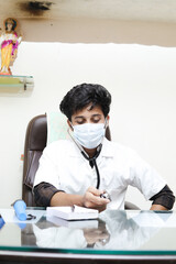 smart indian doctor in clinic