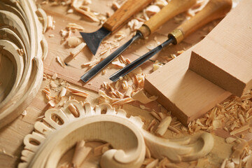 Professional tools on a wooden table in the workshop. Surface covered with sawdust. Carpenter...