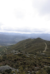 Peaks in a cloudy landscape - Valleys in Galicia are crisscrossed with paths and adorned with crops, portraying the agricultural richness of the region.
