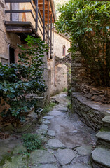 Narrow road inside the beautifully preserved medieval village Carmine Superiore. Cannobio. Northern...