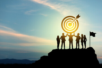 Goal setting towards planning for the future. Silhouettes of group businessmen holding target...