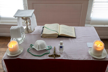 Mass in a catholic oratory during the COVID-19 epidemic in Evreux, France. Altar.