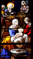 Obraz na płótnie Canvas Sainte Croix (Holy Cross) church, Bernay, Eure, France. Stained glass. Jesus as a baby.