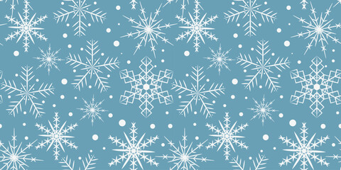 Blue seamless pattern with white snowflakes