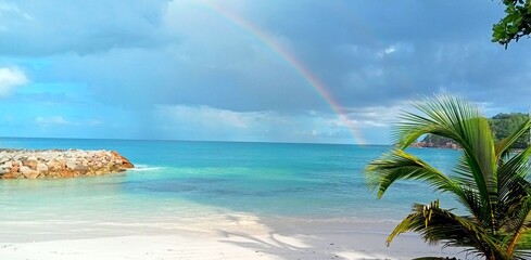 Fototapeta na wymiar Rainbow over the Indian Ocean