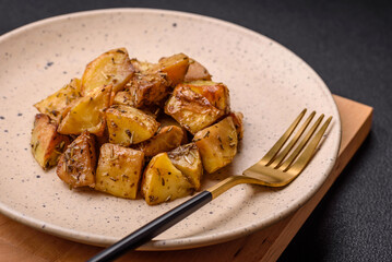 Delicious crispy fried potato wedges with salt, spices and herbs