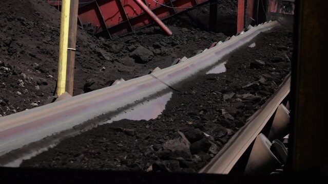 Iron Ore Transported By Conveyor Belt At Coal Mining Site In Berau, Indonesia. - closeup, static shot