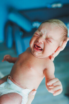 Baby crying close-up. A baby with peeling skin on his face.