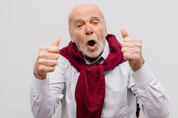 The hand of an elderly man shows a gesture of approval. Hand shows class gesture. Everything is...