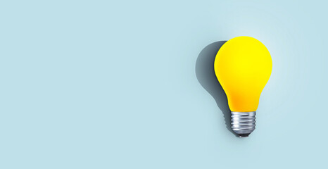 Creative yellow light bulb with shadow burns on a blue background, concept. Think differently, creative idea. The light came on. Brainstorm and thinking. Education and training. Free copy space