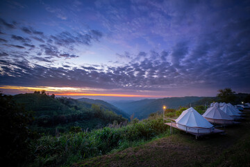 Top beautiful view landscape point from tourist campsite accommodation outdoor with nature of green mountain blue sky background.